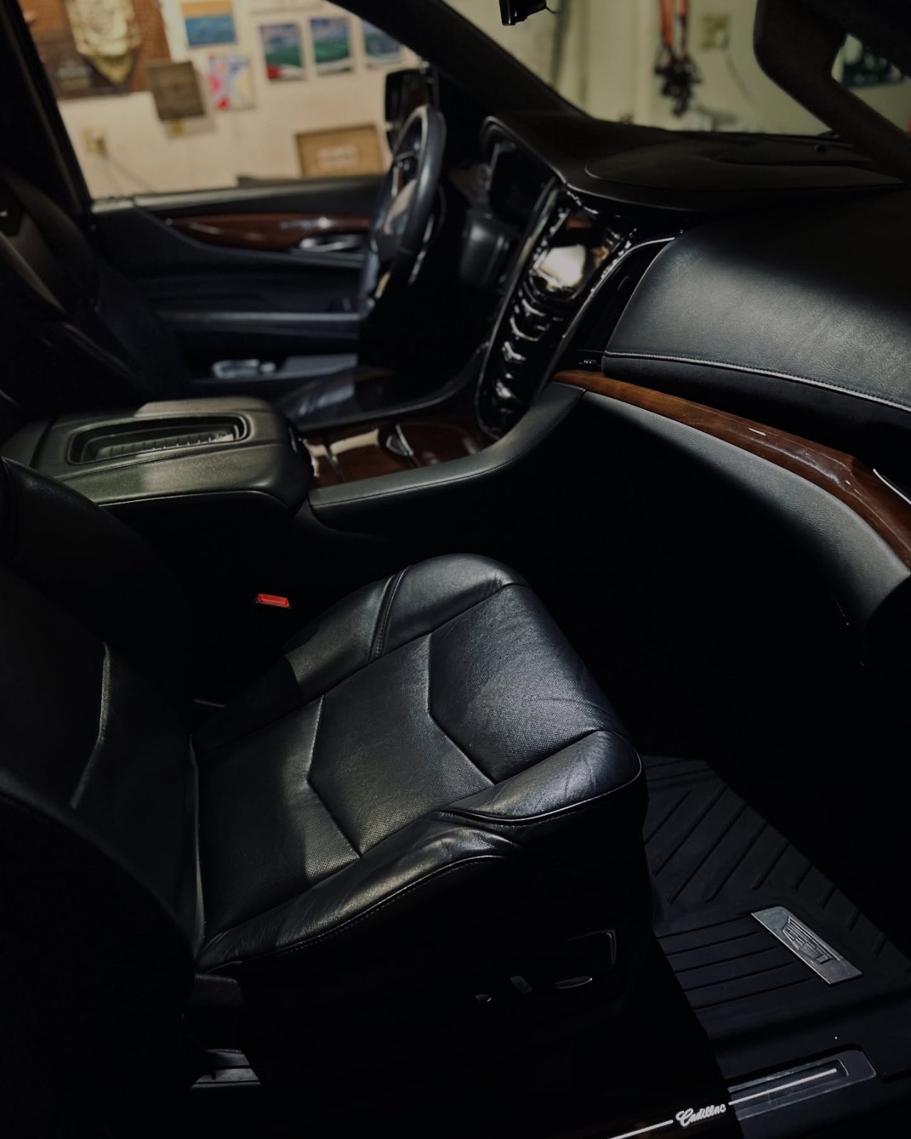 Black leather Cadillac Escalade interior after a deep-clean detail